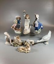 Group of seven Spanish porcelain Nao and Lladro figurines of children and animals to include: