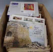 Guernsey selection of mint stamps, presentation packs and First Day Covers in envelopes as