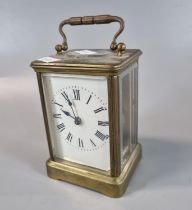 French Brass carriage clock with full depth enamel Roman face. 12cm high approx. (B.P. 21% + VAT)