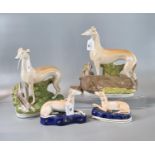 Collection of Staffordshire Pottery figures of greyhounds with prey and two similar pen holders with