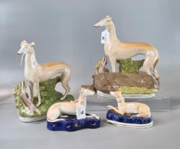 Collection of Staffordshire Pottery figures of greyhounds with prey and two similar pen holders with