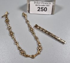 9ct gold tie pin. 2.6g approx. together with a yellow metal ladies bracelet. (B.P. 21% + VAT)