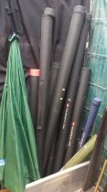 Quantity of assorted modern fishing rods, carbon and others, all in protective carrying tubes