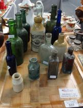 Tray of glass and stoneware bottles to include: a two tone bottle marked 'Rees Lewis & Son Mineral