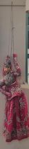 Novelty wooden headed and hand painted puppet in the form of a dancing Indian lady with dress and