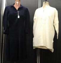 Two early 20th Century woollen items of vintage fashion: a dark blue shirt dress with button up