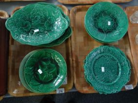 Two trays of moulded green glazed 19th Century majolica leaf design plates and dishes in various