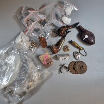 Box of oddments to include: vintage and other pipes, Oriental soapstone seal, rifle and other badges