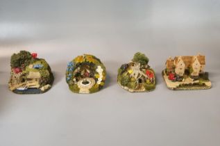 Four Royal Doulton 'The Wind in the Willows' hand made in Scotland sculptures in original boxes by