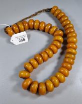 Amber coloured beaded necklace. (B.P. 21% + VAT)