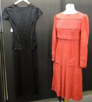 A long black silk 1930's vintage dress and a 30's or 40's vintage red crepe silk long sleeve dress
