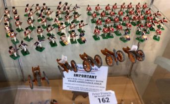 Collection of small scale hand painted cast metal Napoleonic War soldiers with cannons, bandsmen and