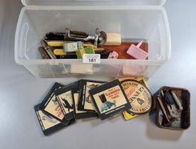 Plastic tub of oddments to include: Guinness advertising coasters, cut throat razors, corkscrews,