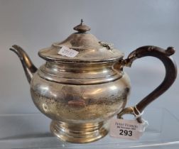 Silver baluster teapot with turned wooden handle. London hallmarks. 16 troy oz approx. (B.P. 21% +