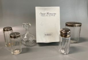 Four glass dressing table jars with silver covers. 2 troy oz approx. Together with Marquis Waterford