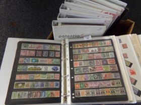 Collection of mostly foreign stamps on pages and stock pages in eight large binders. Many 100s of