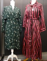 Two vintage 1940's dresses: a black and fuchsia striped shirt dress and a dark green floral print