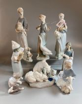 Eight Lladro Spanish porcelain figures to include: a group of three polar bears, children with