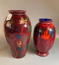 A pair of red glazed baluster vases; one flambe glazed Poole pottery and one Park Rose Bridlington