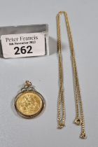 George V gold half sovereign 1911 in 9ct gold mount and chain. 8.8g approx. (B.P. 21% + VAT)