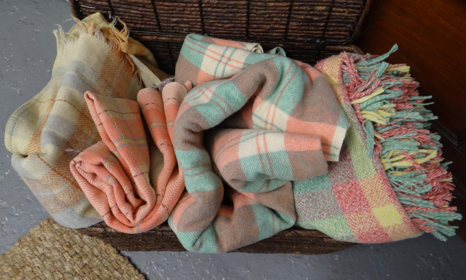 Four vintage woollen check blankets or carthen in different colourways. (4) (B.P. 21% + VAT)