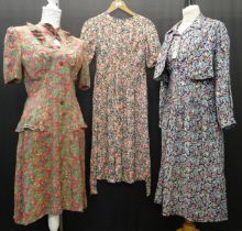 Three vintage floral print 1940's tea dresses: one crepe with ruching, one cotton long sleeved