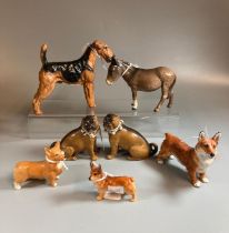 Group of ceramic animal figures to include: Beswick and Royal Doulton Corgis, Beswick donkey,