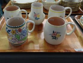 Tray containing four Poole pottery hand decorated floral mugs and a vase. (B.P. 21% + VAT)