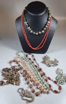 Bag of assorted necklaces to include: Italian style glass, green glass, coral finish etc. Together