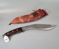 Nepalese Kukri with hardwood handle and leather scabbard with two small additional knives. (B.P. 21%