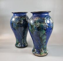 Pair of Danico, Denmark Art Pottery blue ground floral and foliate vases, impressed marks to the