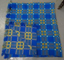 Vintage blue ground woollen Welsh tapestry blanket with traditional Caernarfon design and fringed