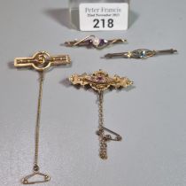 Collection of Victorian/Edwardian brooches, one with diamond chips and ruby, 9ct and 14ct. total