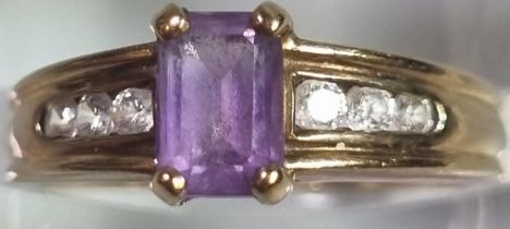 9ct gold, cubic zirconia and purple stone dress ring. 2.3g approx. Size K. (B.P. 21% + VAT)