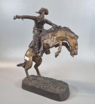 After Frederic Remington (American 1861-1909), a bronze equestrian group of 'The Bronco buster'.
