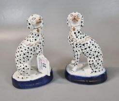 Small pair of 19th century Staffordshire porcellaneous seated Dalmatians with gilded chains and
