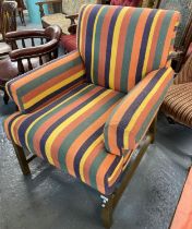 Early 20th century multicoloured fabric armchair on an oak frame. (B.P. 21% + VAT)