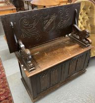 20th century oak Monks bench, plaque to the interior 'L. Marcus ltd'. (B.P. 21% + VAT)