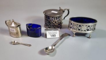 Silver mustard pot together with another silver mustard pot with blue glass liner of pierced