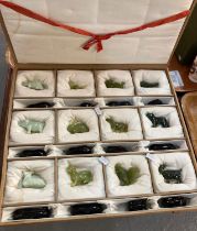 Case collection of Chinese Zodiac animals of the year in green hardstone with hardwood stands in