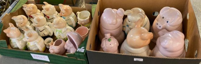 Three boxes of assorted novelty teapots in form of cottages and pigs together with a box of