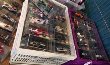 Large collection of small scale Formula 1 cars from the 1950s to the present day, all in Perspex
