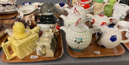 Two trays of novelty teapots in the form of: footballs, golf balls, Henry VIII etc. (2) (B.P.
