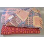 Pink ground Welsh woollen tapestry traditional Caernarfon design fringed edge blanket, together with