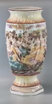 Italian Capodimonte floor vase depicting relief figures with baskets of fruits. 54cm high approx. (