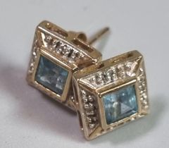 Pair of 9ct gold Art Deco style blue stone earrings of square form, possibly aqua. (B.P. 21% +