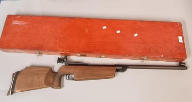 German .177 target air rifle with moulded stock, peephole sight and plywood carrying case. OVER