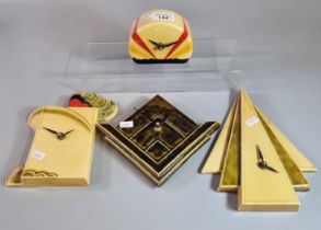 Collection of four ceramic Art Deco design battery operated clocks of geometric and similar designs.