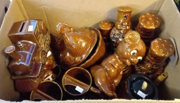 Four boxes of assorted modern pottery zoomorphic biscuit barrels, animal figures, condiments,