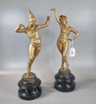 Pair of early 20th century gilded spelter circus performers on ebonised socle bases. 38cm high